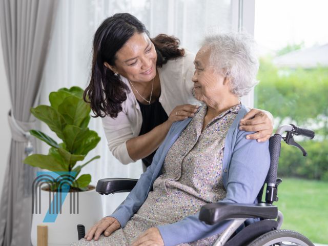 Caregiver Supporting Senior in Wheelchair