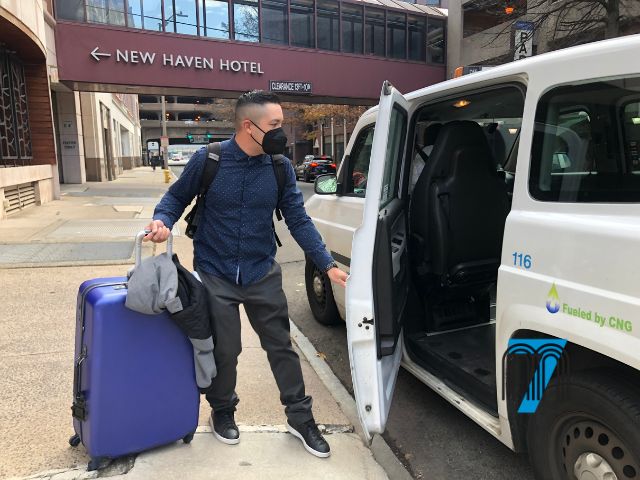 Passenger Boarding Transportation Near a Hotel