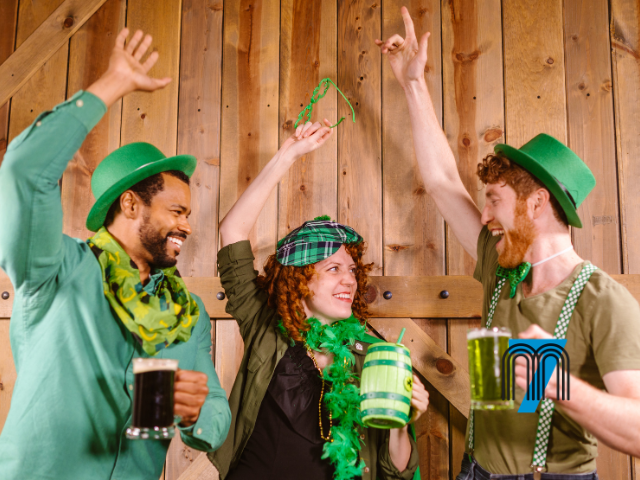 Friends Celebrating St. Patrick’s Day With Drinks and Green Attire