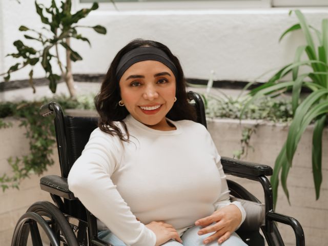 Wheelchair Rider Smiling Waiting for Accessible Travel