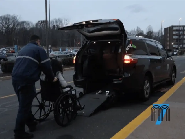 Assisting Passenger Using a Wheelchair Into a Van